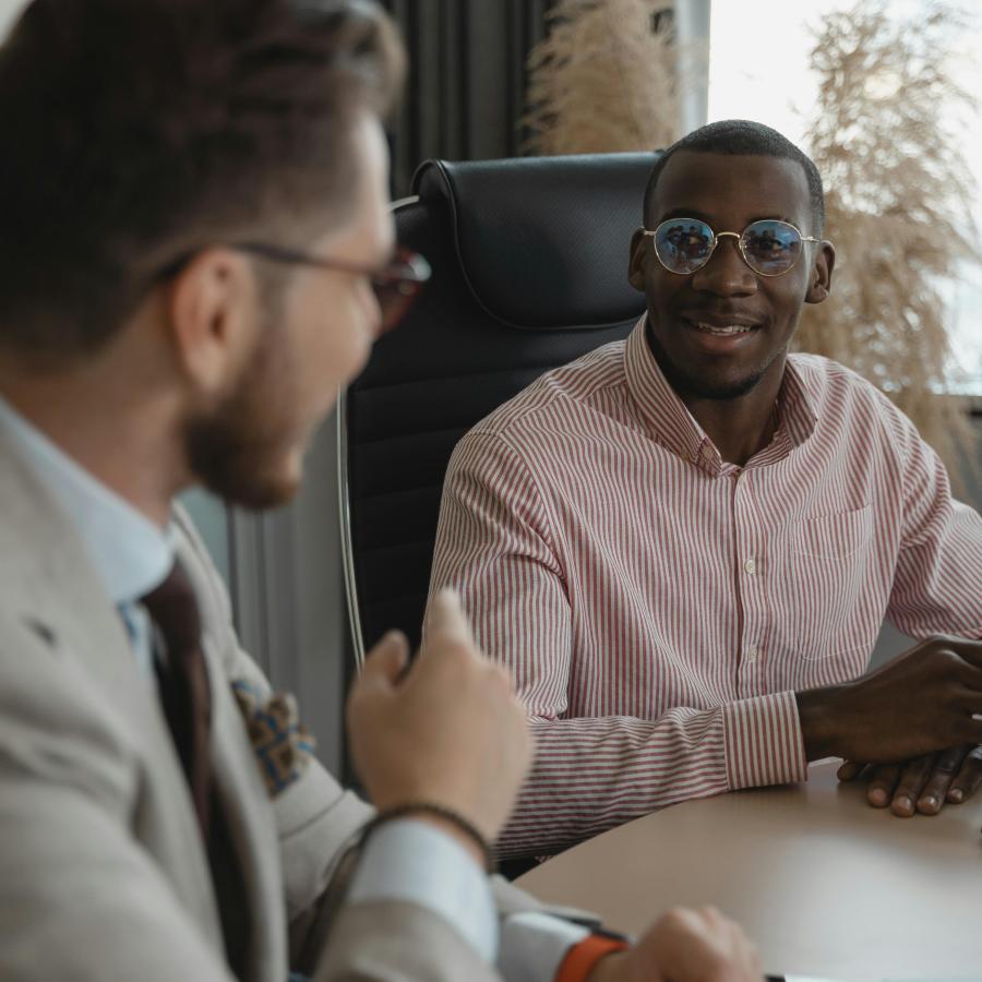 Two guys talking in an office